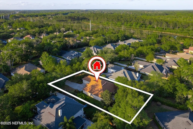 aerial view with a residential view and a view of trees