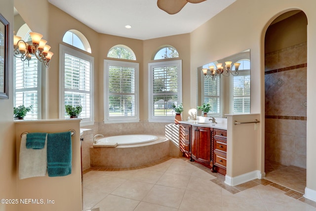 full bathroom featuring a walk in shower, vanity, tile patterned floors, ceiling fan with notable chandelier, and a bath