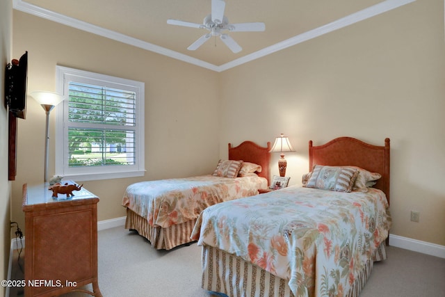 carpeted bedroom featuring baseboards, ornamental molding, and ceiling fan