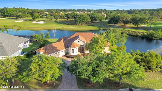 bird's eye view with a water view and golf course view