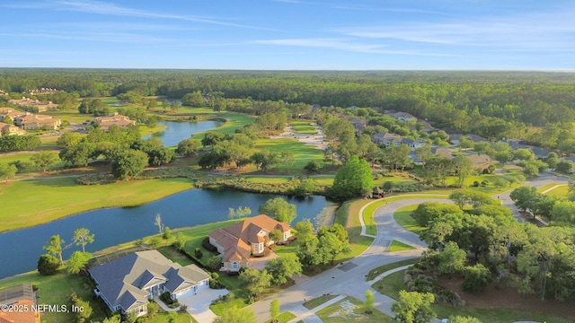 birds eye view of property with a residential view, a water view, and a forest view
