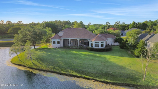 view of front facade with a water view and a front yard