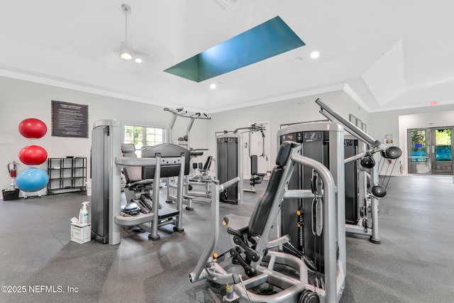 exercise room featuring ornamental molding and recessed lighting