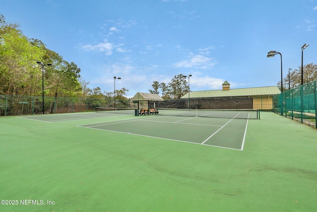 view of sport court featuring fence and community basketball court
