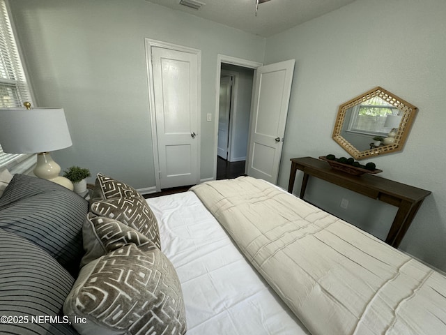 bedroom featuring visible vents