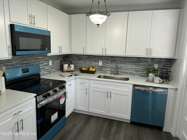 kitchen with light countertops, stainless steel electric range, dishwasher, a sink, and white cabinetry
