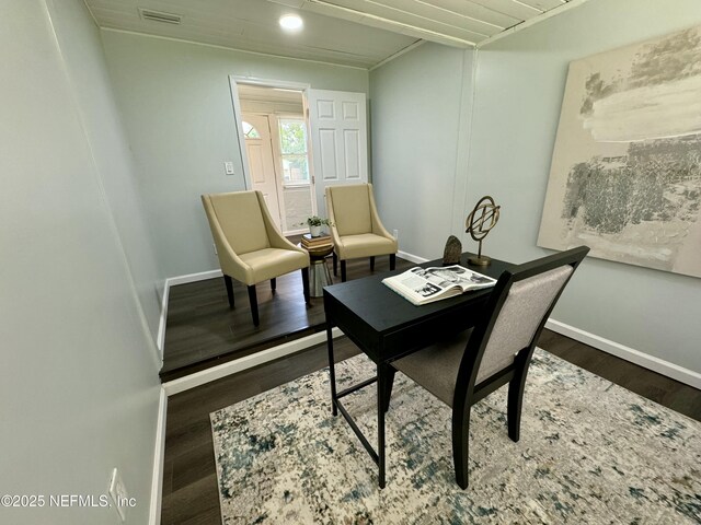 office area featuring wood finished floors, visible vents, and baseboards