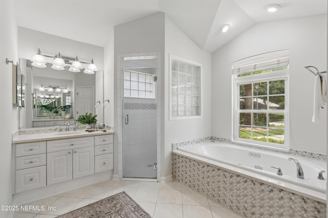full bathroom with a garden tub, tile patterned flooring, a stall shower, vanity, and lofted ceiling