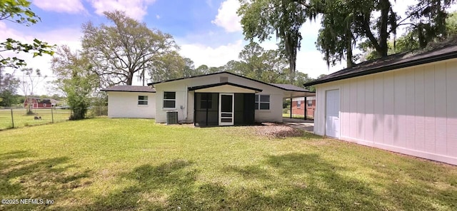 back of house with fence, a yard, and central AC unit