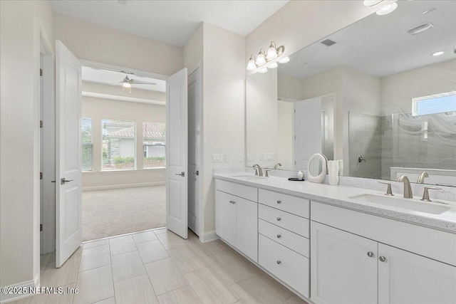 full bath with visible vents, walk in shower, plenty of natural light, and a sink