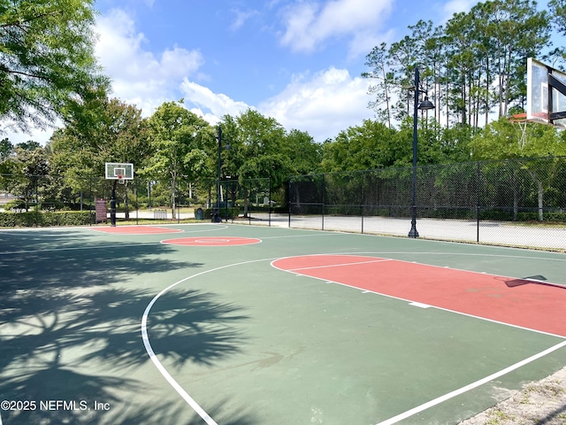 view of sport court featuring fence and community basketball court