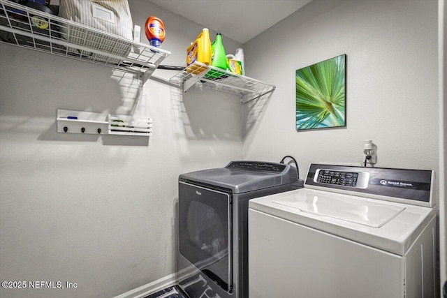 washroom with laundry area and washing machine and dryer