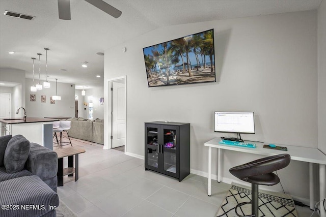 living room featuring ceiling fan, recessed lighting, baseboards, light tile patterned floors, and visible vents