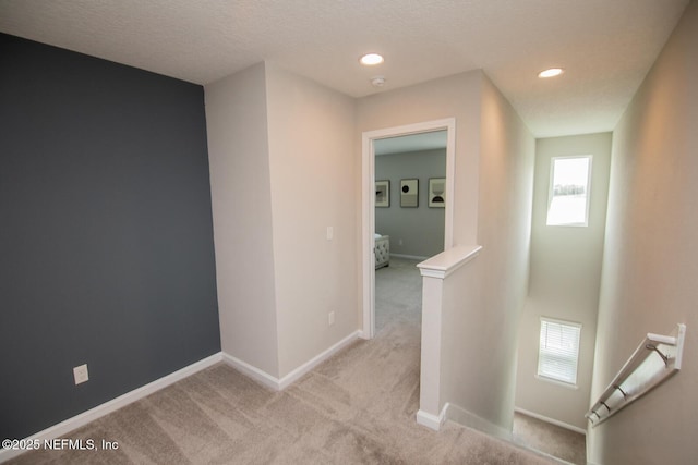11213 Minnetta Ct, Jacksonville, FL 32256 - hallway featuring recessed lighting, an upstairs landing, visible vents, light carpet, and baseboards