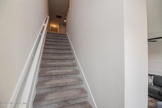 11213 Minnetta Ct, Jacksonville, FL 32256 - stairs with visible vents and baseboards