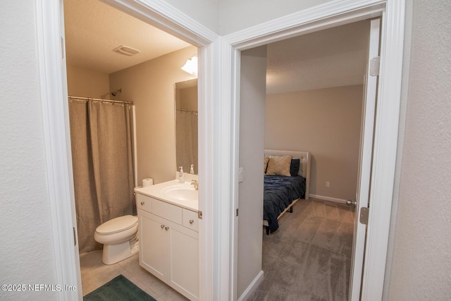 11213 Minnetta Ct, Jacksonville, FL 32256 - bathroom with toilet, visible vents, and vanity
