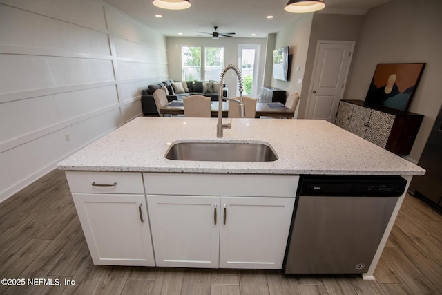 11213 Minnetta Ct, Jacksonville, FL 32256 - kitchen featuring a sink, ceiling fan, white cabinetry, stainless steel dishwasher, and open floor plan