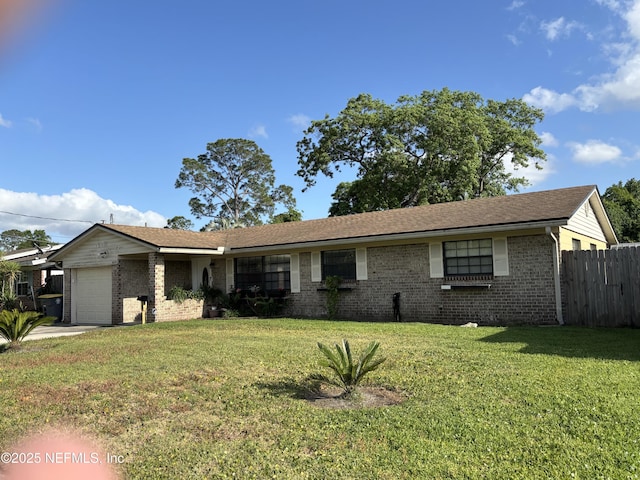 ranch-style home with fence, a front yard, brick siding, and a garage