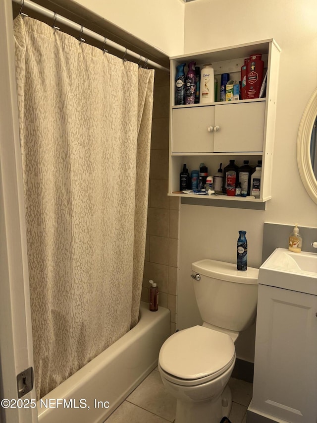 bathroom with shower / bath combo, vanity, toilet, and tile patterned flooring