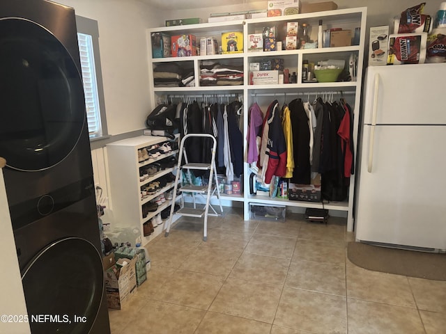 6050 Carrevero Dr S, Jacksonville, FL 32216 - laundry room featuring stacked washer / drying machine and tile patterned floors