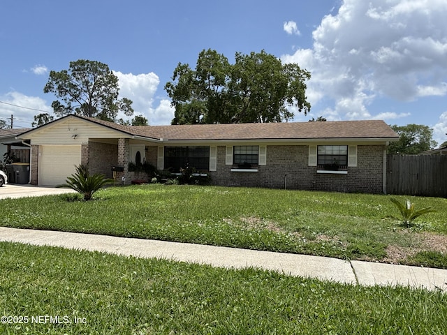 6050 Carrevero Dr S, Jacksonville, FL 32216 - ranch-style house featuring an attached garage, brick siding, and driveway
