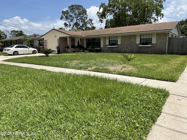 6050 Carrevero Dr S, Jacksonville, FL 32216 - single story home featuring a garage, brick siding, and concrete driveway