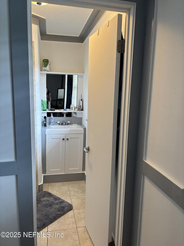 6050 Carrevero Dr S, Jacksonville, FL 32216 - bathroom with vanity and tile patterned floors