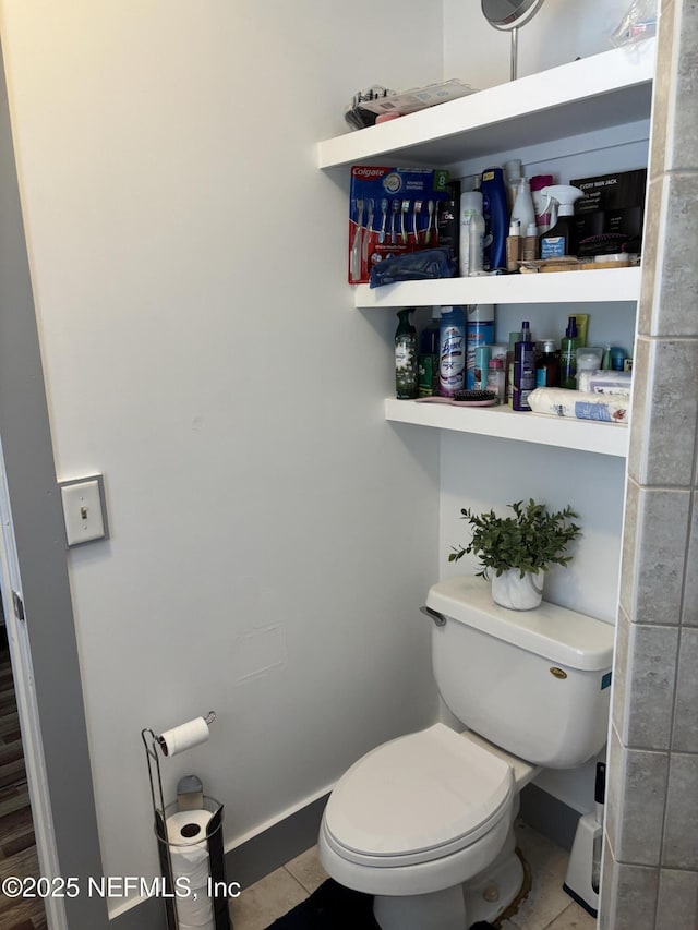 6050 Carrevero Dr S, Jacksonville, FL 32216 - bathroom with toilet, tile patterned flooring, and baseboards