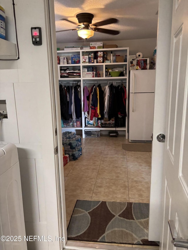 6050 Carrevero Dr S, Jacksonville, FL 32216 - walk in closet with ceiling fan, tile patterned floors, and washer / clothes dryer