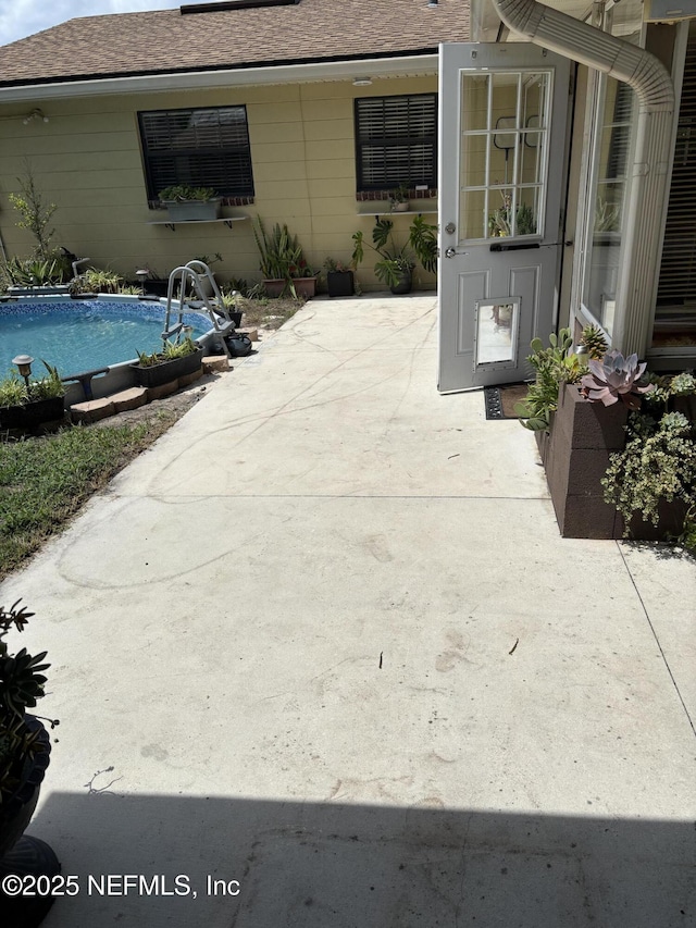 6050 Carrevero Dr S, Jacksonville, FL 32216 - view of patio / terrace with an outdoor pool