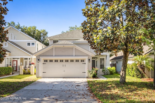 1821 Enterprise Ave, Saint Augustine, FL 32092 - view of front of home featuring concrete driveway, an attached garage, and stucco siding