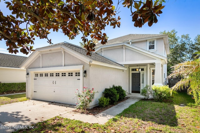 1821 Enterprise Ave, Saint Augustine, FL 32092 - traditional home with an attached garage, concrete driveway, stucco siding, and a shingled roof