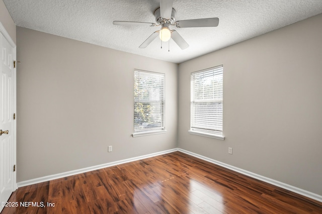 1821 Enterprise Ave, Saint Augustine, FL 32092 - empty room featuring wood finished floors, baseboards, a ceiling fan, and a textured ceiling