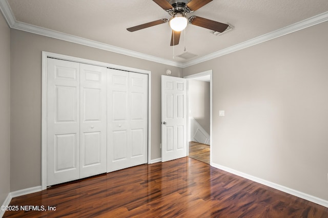 1821 Enterprise Ave, Saint Augustine, FL 32092 - unfurnished bedroom featuring wood finished floors, crown molding, a closet, and baseboards