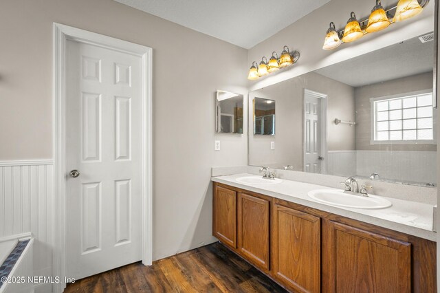 1821 Enterprise Ave, Saint Augustine, FL 32092 - bathroom with double vanity and wood finished floors