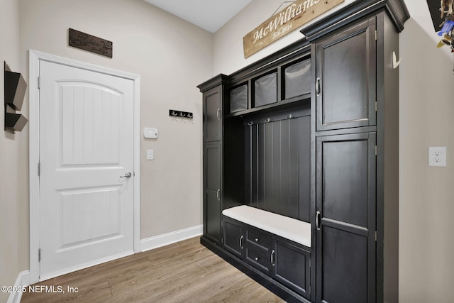 mudroom with baseboards and light wood-type flooring