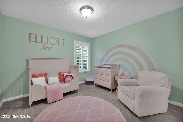 carpeted bedroom with a textured ceiling and baseboards