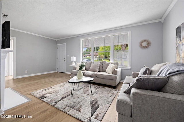 1232 Hamilton St, Jacksonville, FL 32205 - living area featuring a textured ceiling, visible vents, baseboards, ornamental molding, and wood finished floors