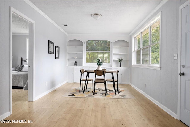 1232 Hamilton St, Jacksonville, FL 32205 - dining area featuring a textured ceiling, built in features, and baseboards
