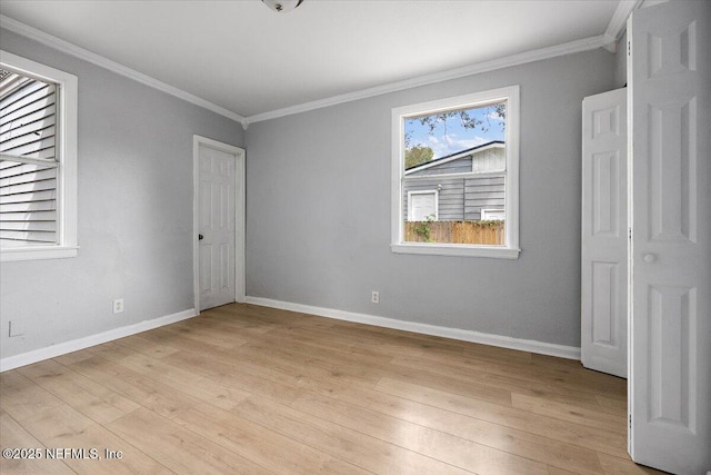 1232 Hamilton St, Jacksonville, FL 32205 - unfurnished bedroom featuring baseboards, light wood finished floors, and crown molding