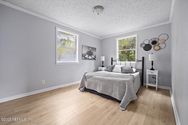 1232 Hamilton St, Jacksonville, FL 32205 - bedroom featuring a textured ceiling, light wood-type flooring, ornamental molding, and baseboards