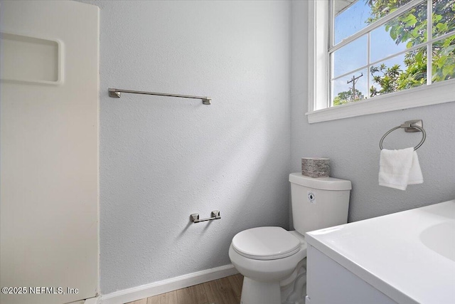 1232 Hamilton St, Jacksonville, FL 32205 - bathroom with baseboards, wood finished floors, and toilet