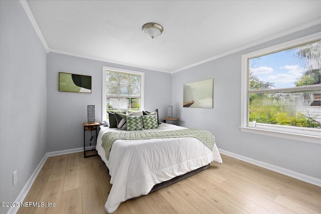 1232 Hamilton St, Jacksonville, FL 32205 - bedroom featuring crown molding, light wood-style flooring, and baseboards