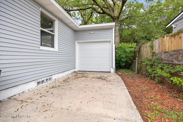 1232 Hamilton St, Jacksonville, FL 32205 - garage featuring driveway and fence
