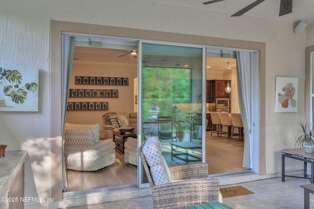 exterior space featuring ceiling fan
