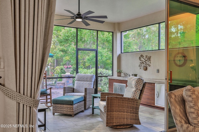 sitting room featuring ceiling fan