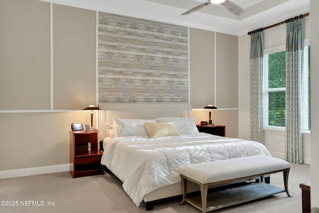 carpeted bedroom featuring a ceiling fan and baseboards