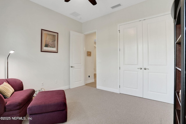 sitting room with ceiling fan, baseboards, carpet floors, and visible vents