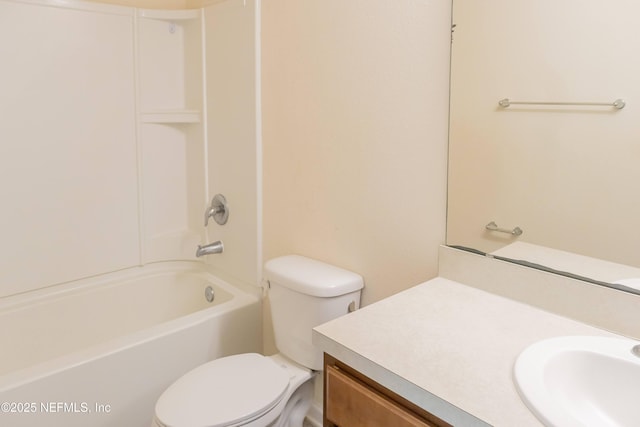 bathroom with vanity, toilet, and shower / tub combination