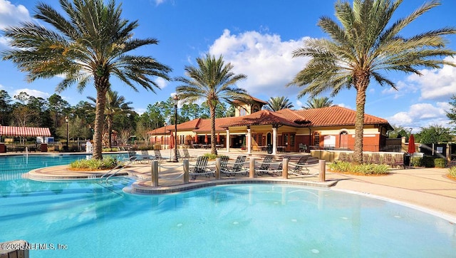 community pool with a patio